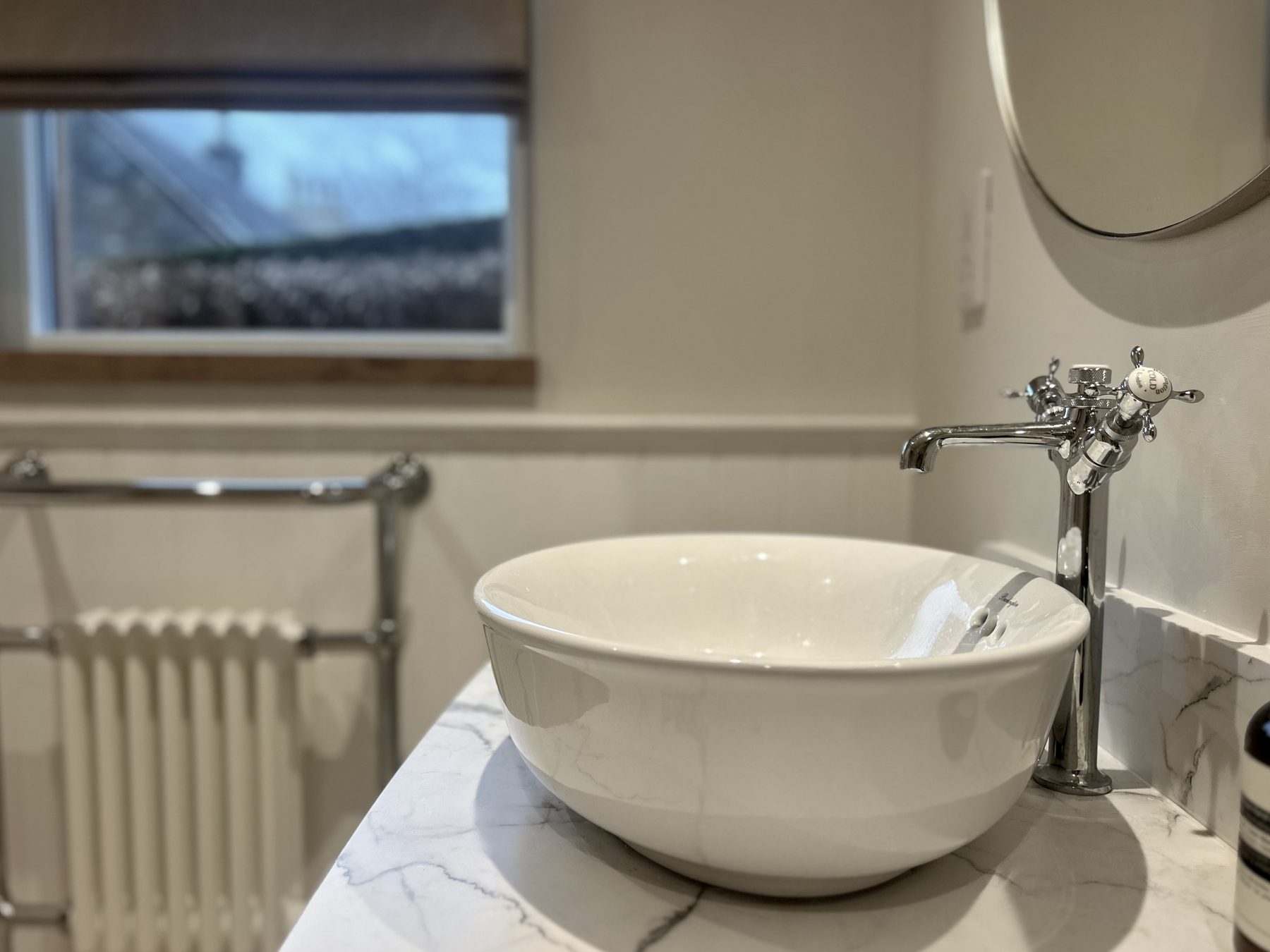 Ensuite basin with brushed chrome tap
