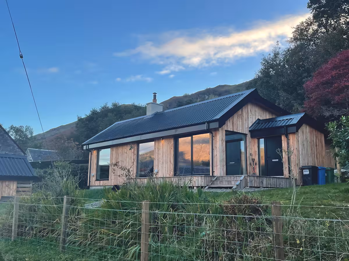 Torran Cottage from the loch side, garden gate open to the water