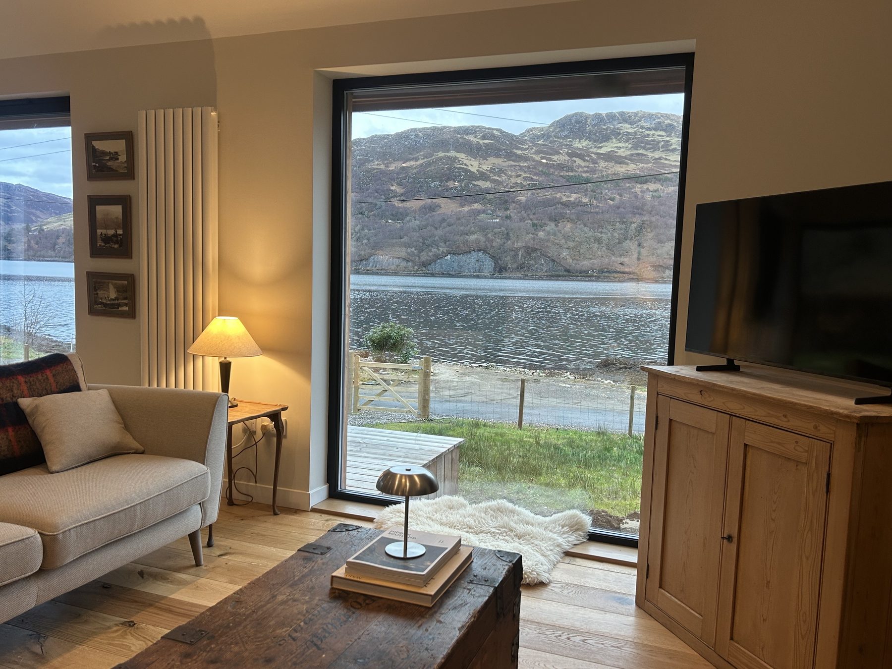 Living room with picture window framing Loch Duich