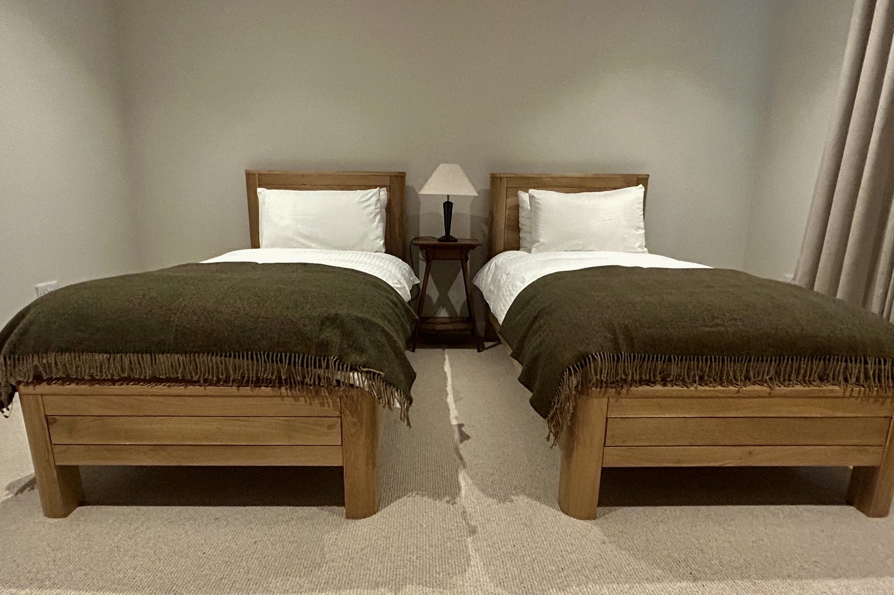 Twin bedroom with wool throws